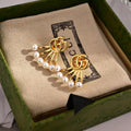 GUCCI 26S DOUBLE G LOGO PEARL FAN DROP EARRINGS IN GOLD TONE METAL 633779