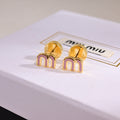 MIUMIU 26S MINI ARCH LOGO PINK ENAMEL STUD EARRINGS IN GOLD TONE METAL 635076