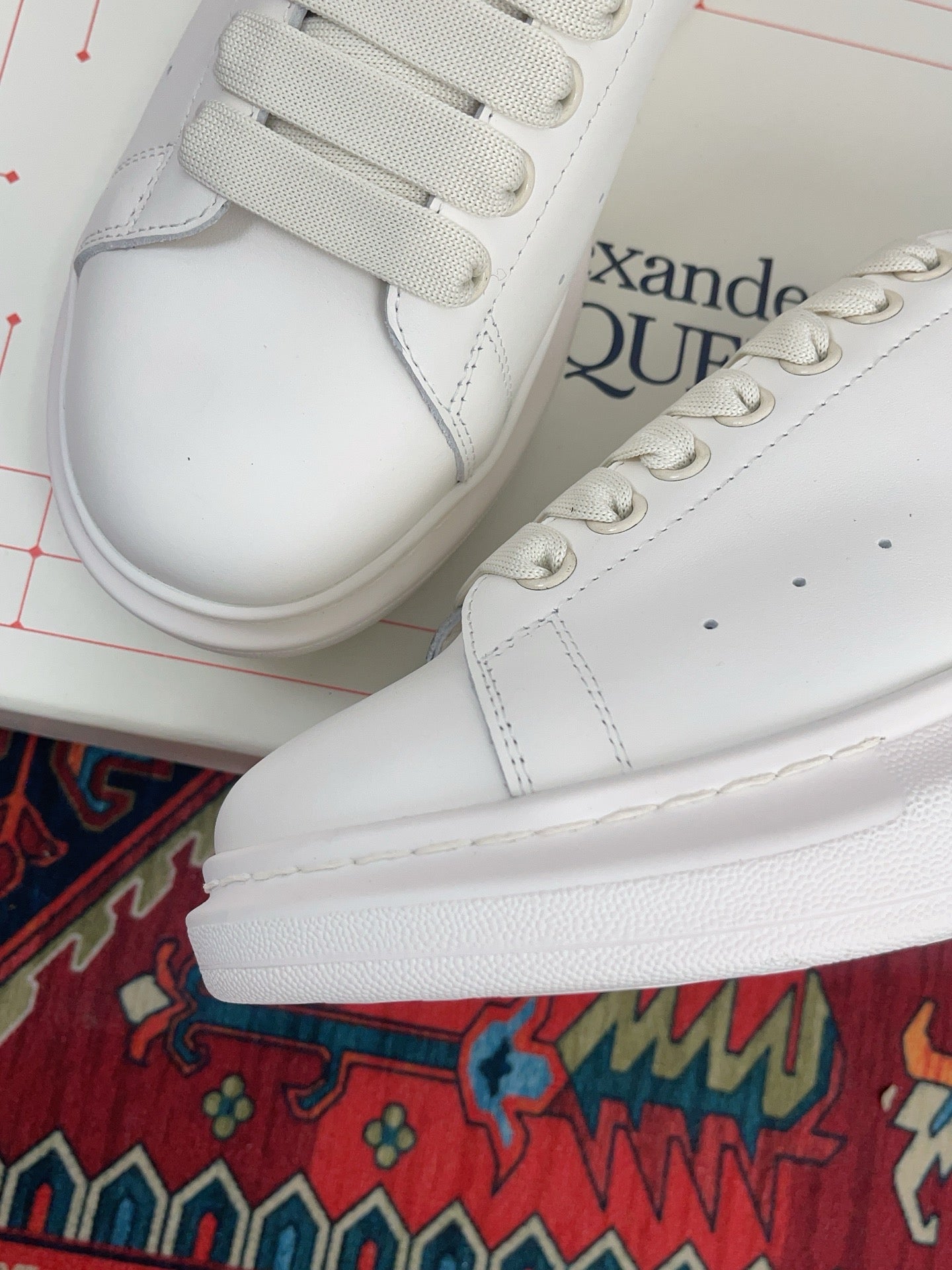 OVERSIZED SNEAKER IN WHITE CALFSKIN WITH EMBOSSED OLIVE GREEN HEEL TAB
