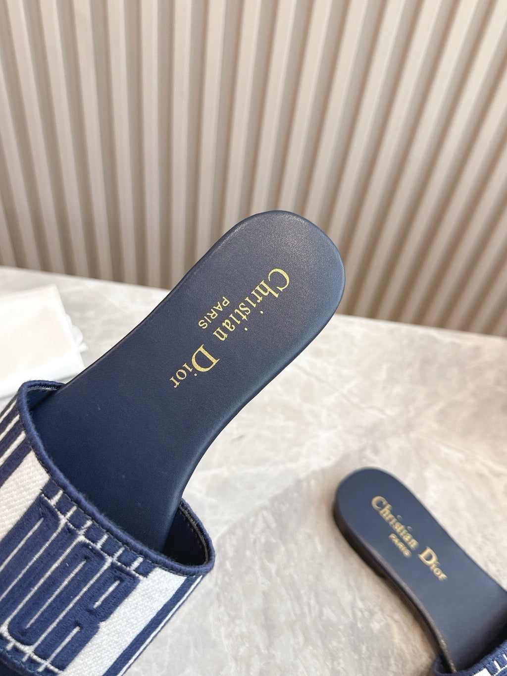 DIOR FLAT SLIDES 25S IN MIDNIGHT BLUE CALFSKIN AND FABRIC BRAND NAME EMBROIDERY