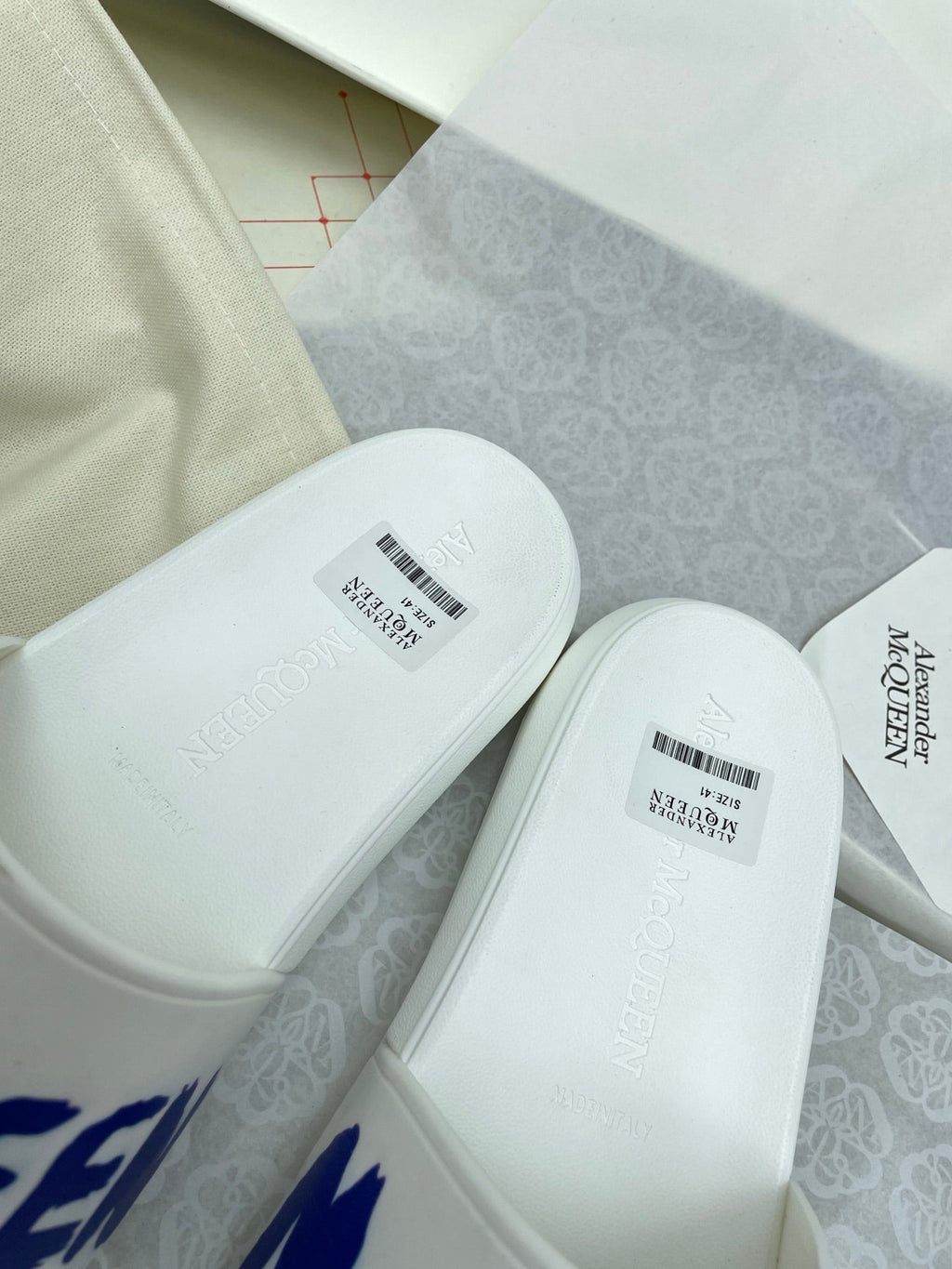SLIDES SANDAL IN WHITE WITH BLUE LOGO GRAPHIC IN STRAP