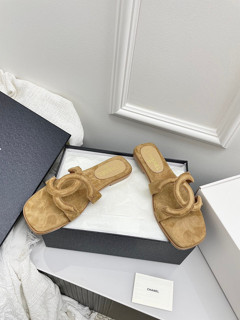 CHANEL CC LOGO MULES IN DARK BEIGE SUEDE