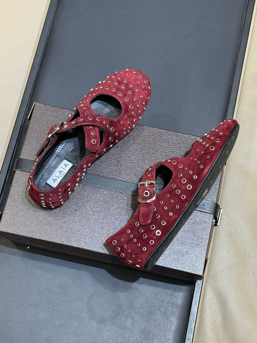 ALAIA 26S CROSS-STRAP FLATS IN DARK RED SUEDE WITH SILVER HARDWARE