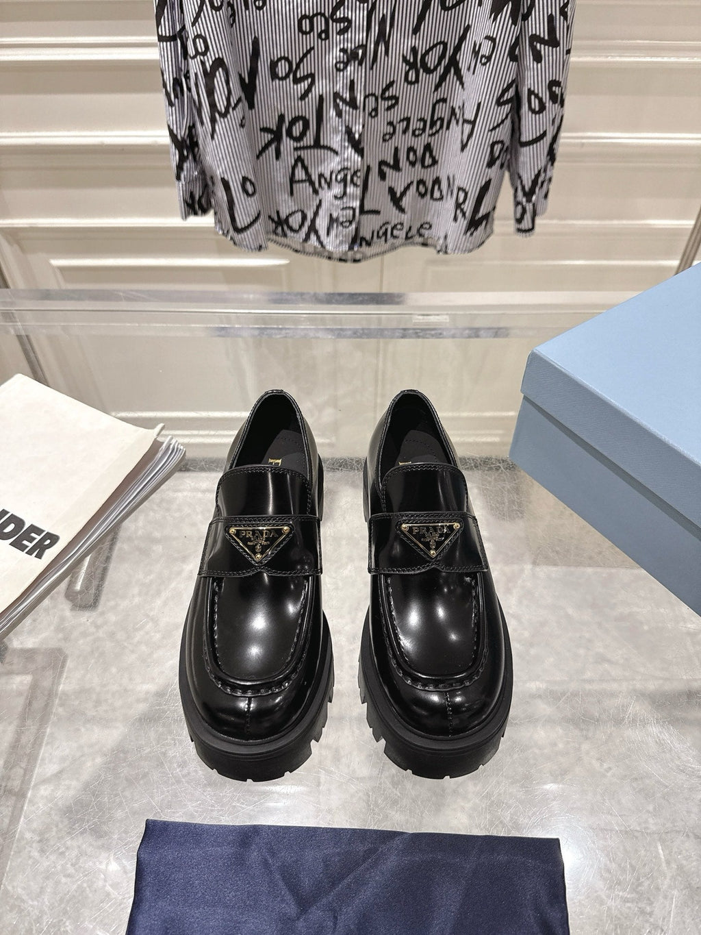 PRADA 26S PLATFORM LOAFERS 45MM IN BLACK SHINE CALFSKIN