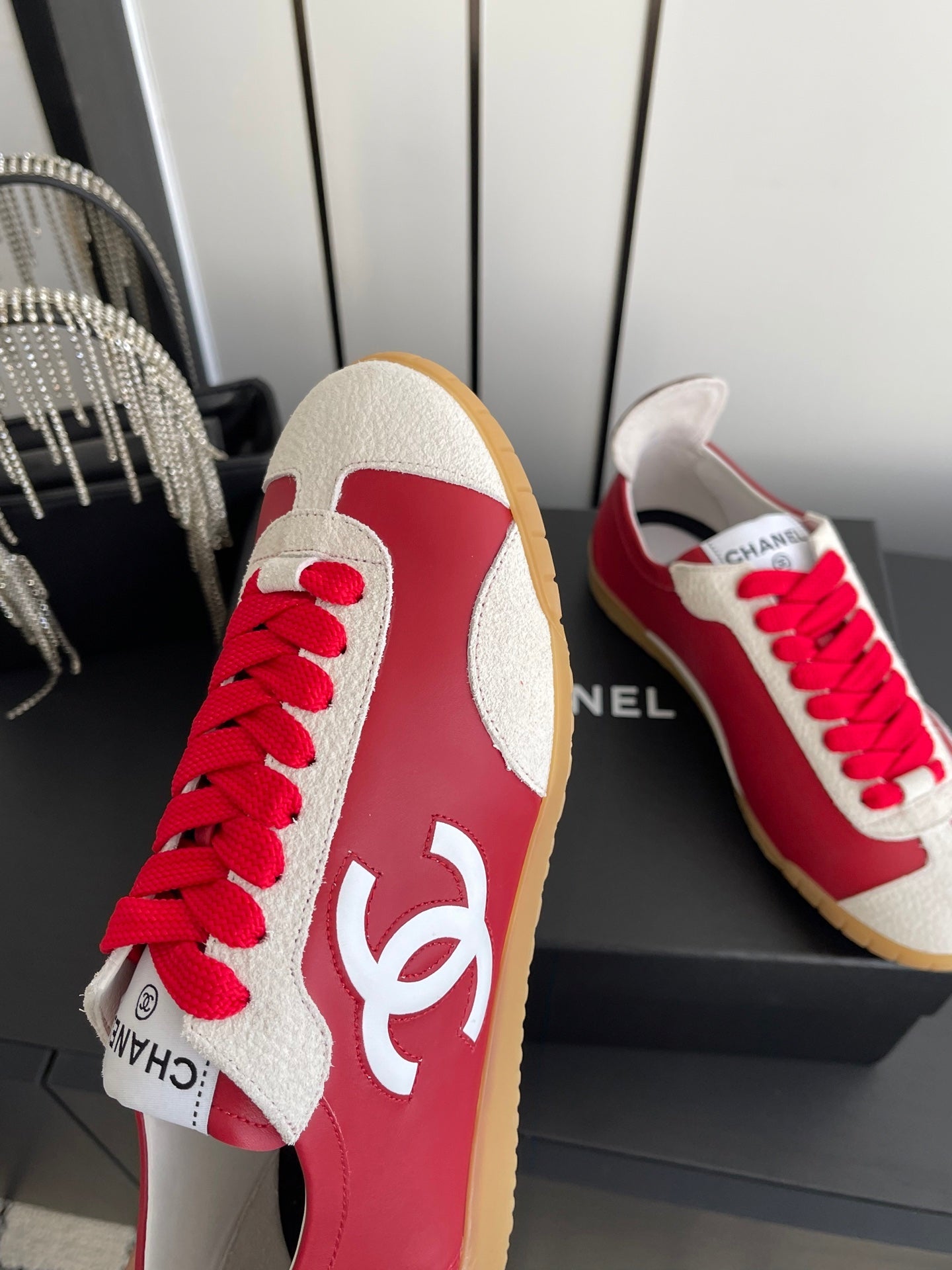 CHANEL LOW-TOP SNEAKERS IN RED CALFSKIN MIX SUEDE