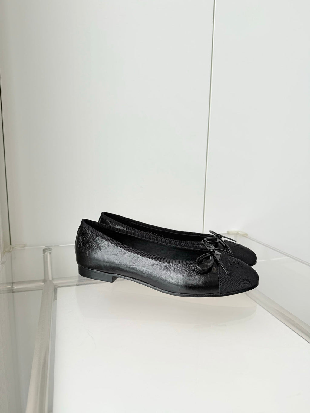 CHANEL 26S BALLET FLATS IN BLACK CALFSKIN WITH FABRIC TOE CAP AND BOW