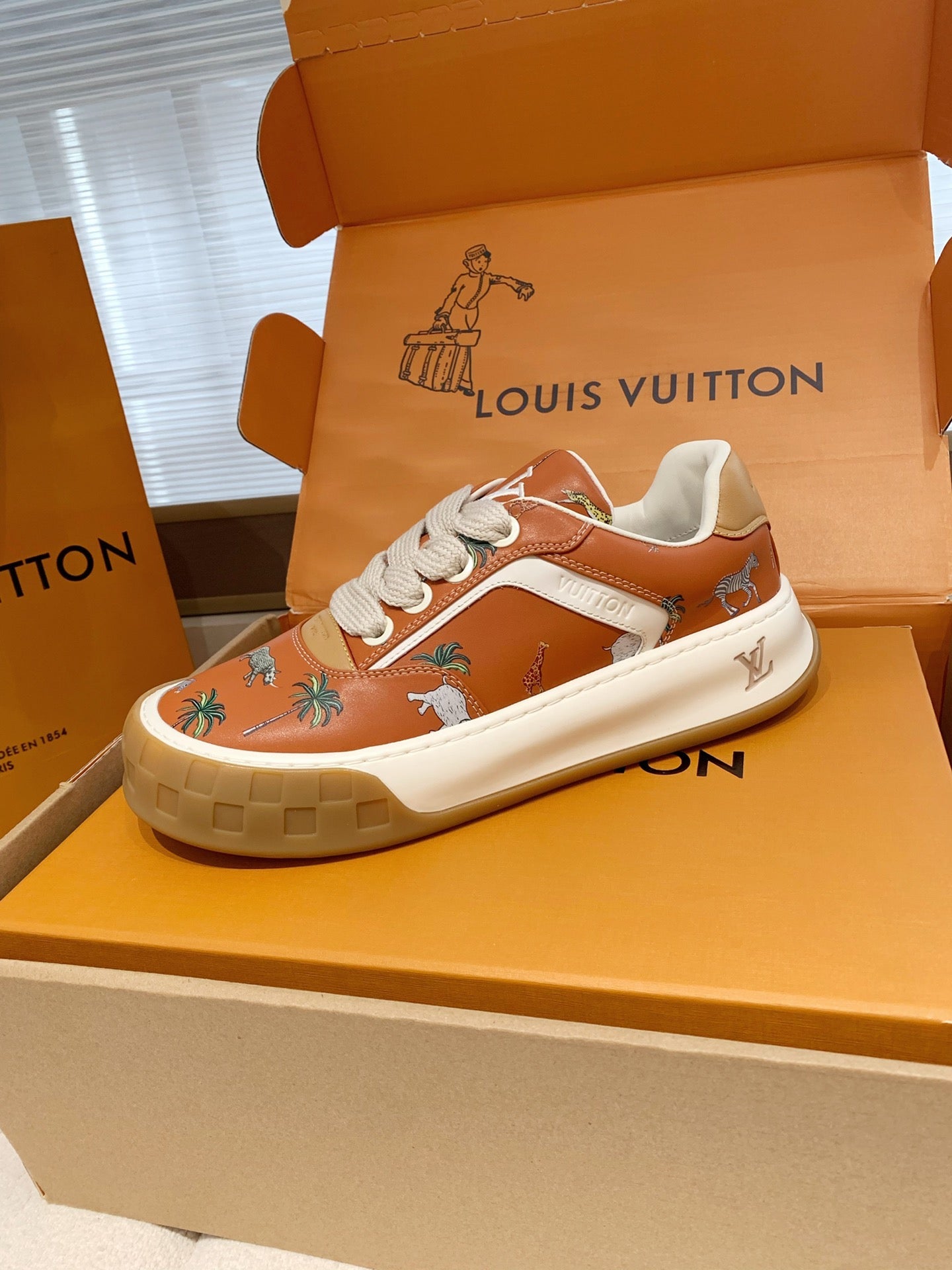 LV 26S TILTED SNEAKERS IN COGNAC ORANGE CALFSKIN SAFARI PRINT