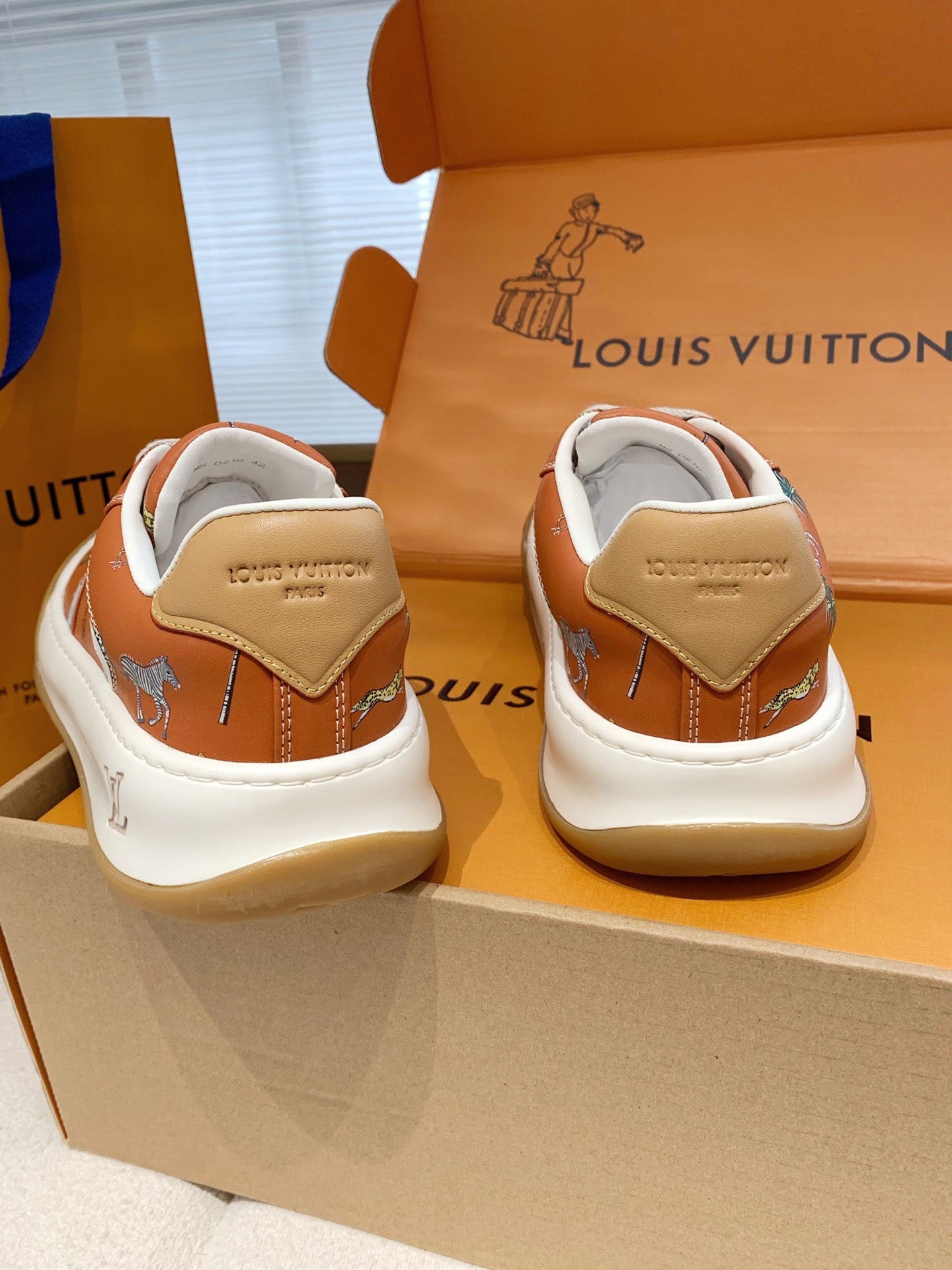 LV 26S TILTED SNEAKERS IN COGNAC ORANGE CALFSKIN SAFARI PRINT