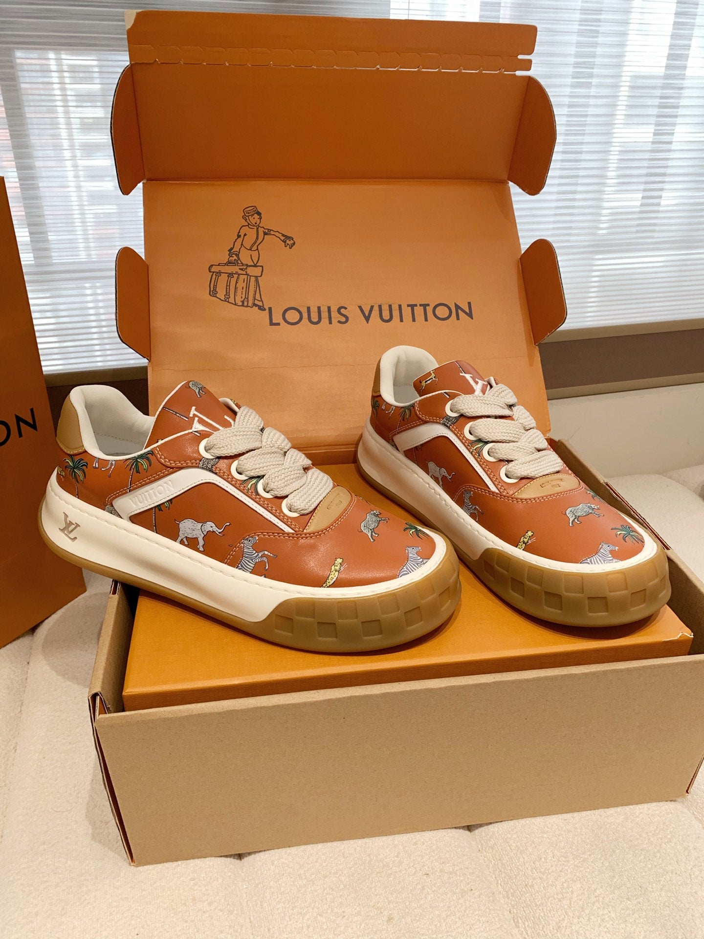 LV 26S TILTED SNEAKERS IN COGNAC ORANGE CALFSKIN SAFARI PRINT