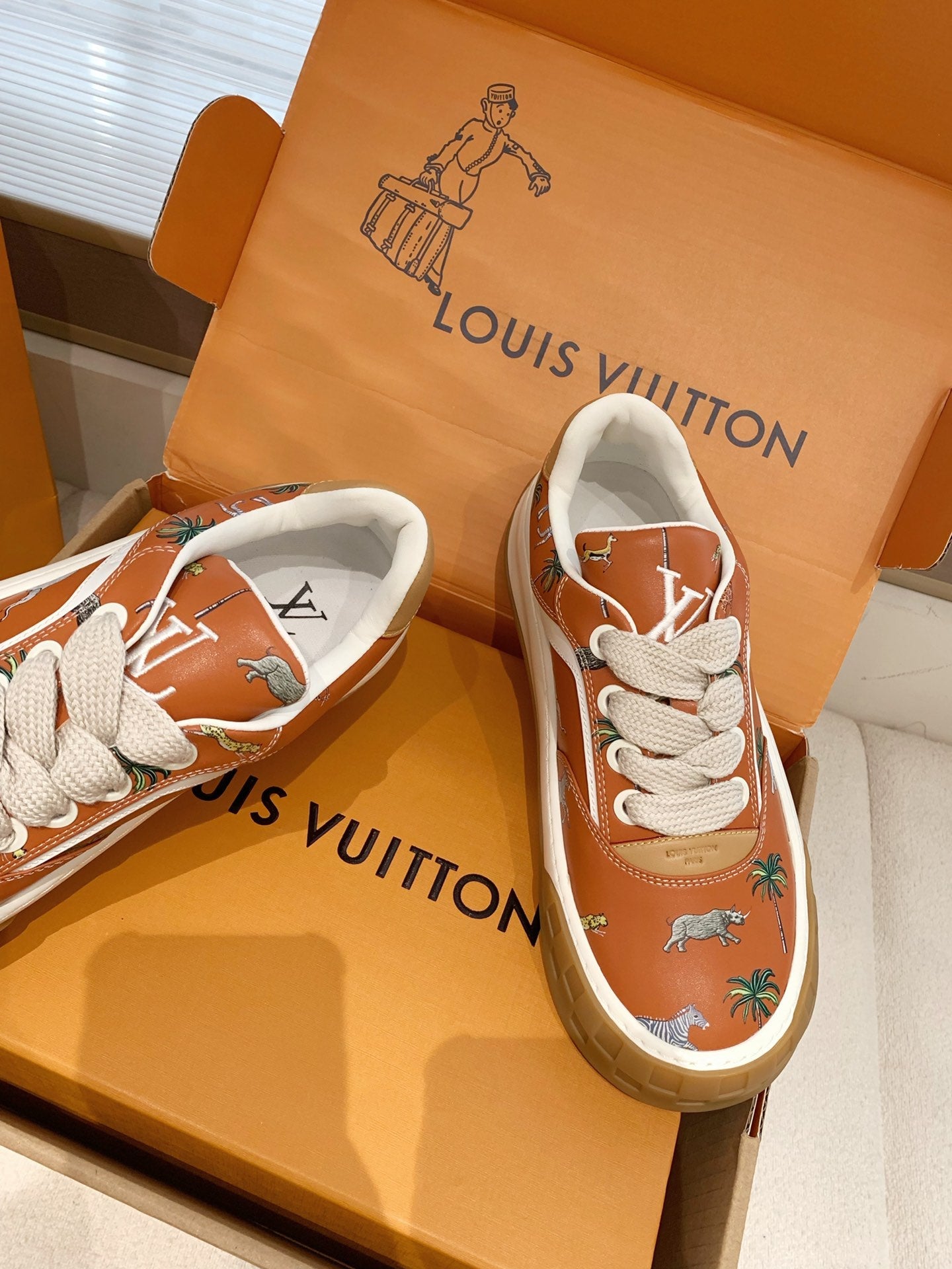 LV 26S TILTED SNEAKERS IN COGNAC ORANGE CALFSKIN SAFARI PRINT